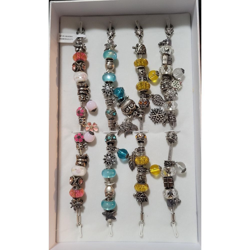 The Four Season Charm Bracelet complete set by Holsted Jewelers.